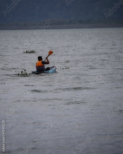 kayaking on the lake of timah tasoh in perlis malaysia photo