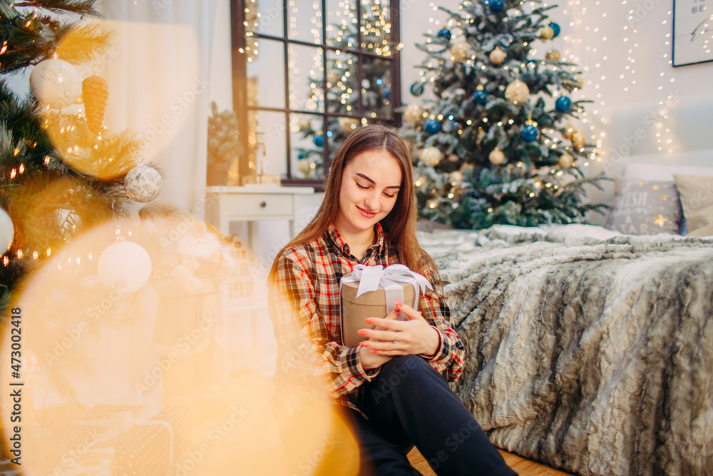 girl with a gift box enjoying winter festive atmosphere girl with a gift box enjoying winter festive atmosphere