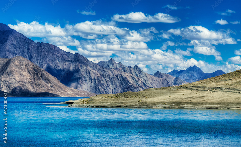 Mountains and Pangong tso (Lake). It is huge lake in Ladakh, shared by China and India along India China LOC border long and extends from India to Tibet. Leh, Ladakh, Jammu and Kashmir, India