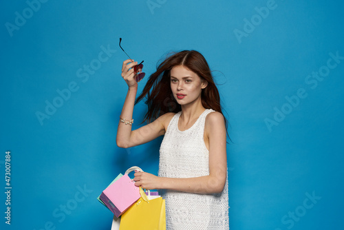 cheerful woman with packages in hands Shopaholic isolated background