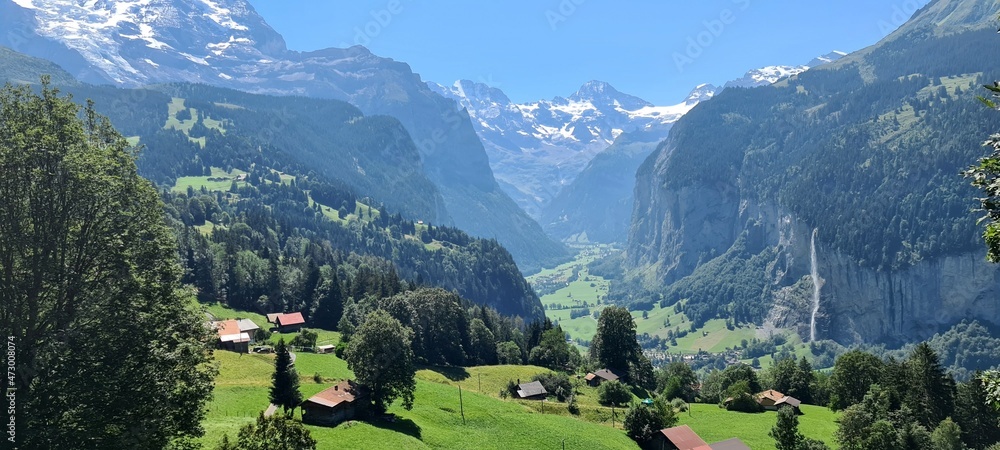 Lauterbrunnen valley with a gorgeous waterfall and Swiss Alps in the background, Berner Oberland, Switzerland