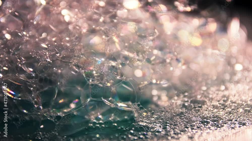 Artistic blur bubbles and dots with rotation slow motion and blue color copy space background. Artistic blur bubbles and dots with rotation slow motion and blue color copy space background.