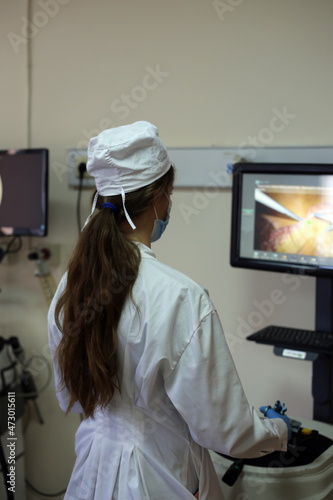 medical student learns laparoscopic surgery on a simulator