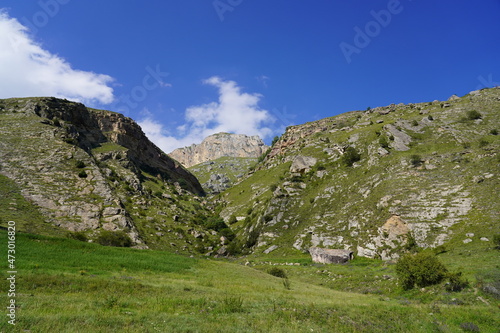 Landscape with sky and clouds. Rocks and hills