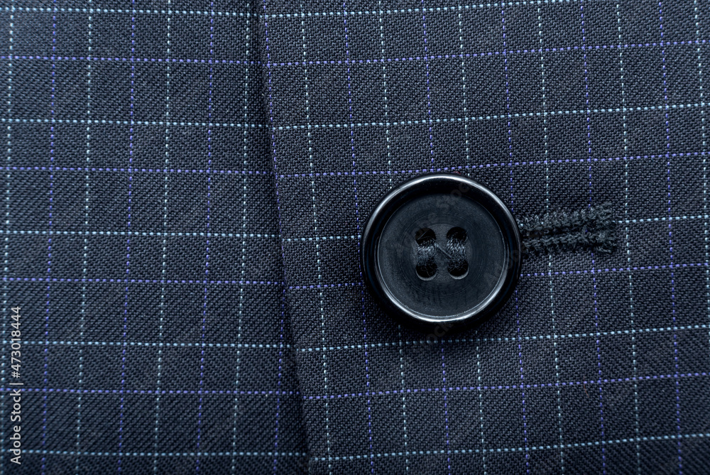 A button on a man's suit close-up. Element of men's clothing. Buttons - obrazy, fototapety, plakaty 