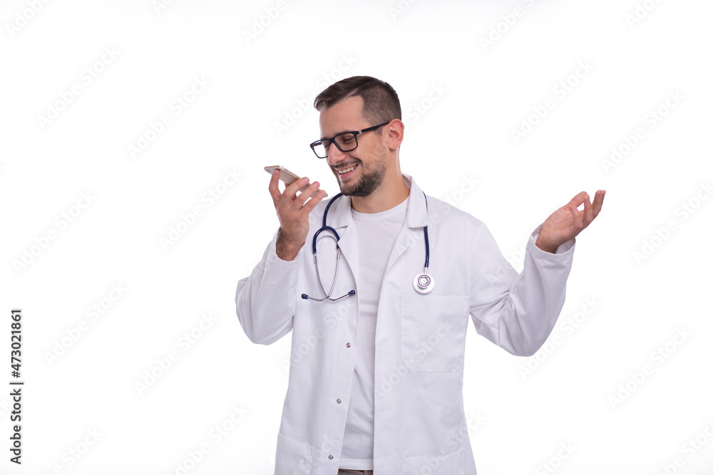 Doctor Talking on Phone Standing Isolated. Doctor Smiling. Commecial, Medicine, Advertisment Concept. Technology Doctor Talking on Phone Standing Isolated. Doctor Smiling. Commecial, Medicine, Advertisment Concept. Technology