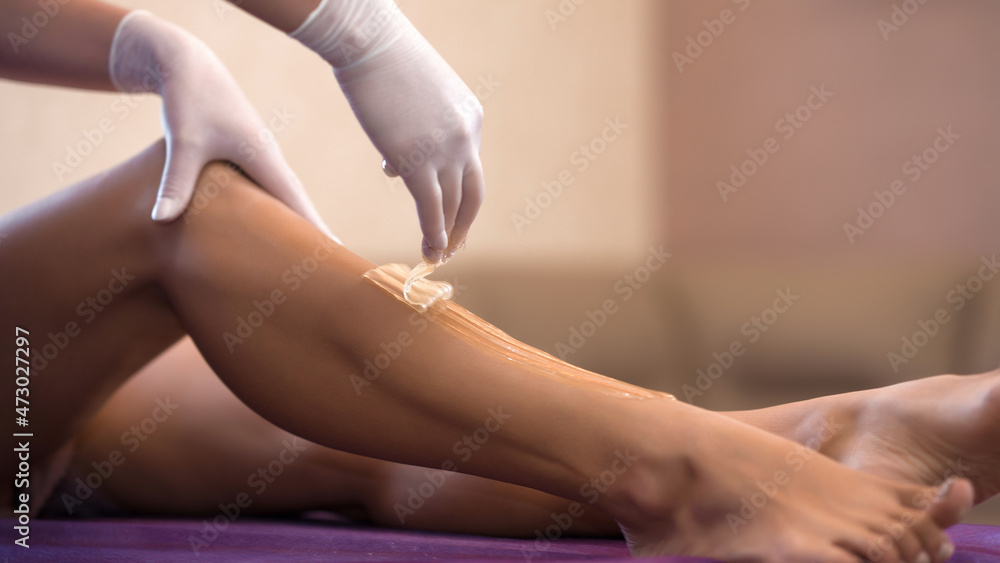 Sugar depilation. Body aesthetics!Body aesthetics and hygiene. Depilation in a beauty salon Sugar depilation. Body aesthetics!Body aesthetics and hygiene. Depilation in a beauty salon