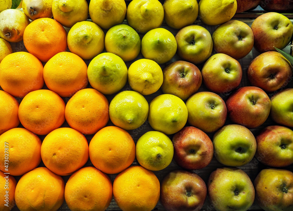 Oranges, pears, lemons and apples arranged nicely on street fruit market in Morocco