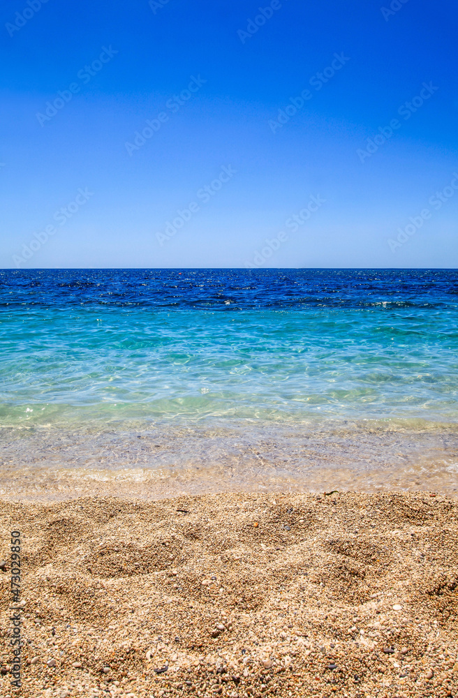 The view of beach, clear sea and blue sky in Greece The view of beach, clear sea and blue sky in Greece