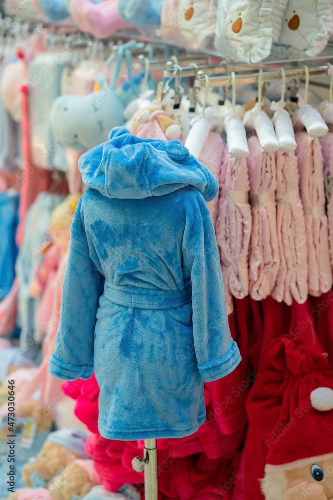 Blue terry bathrobe in a shop window