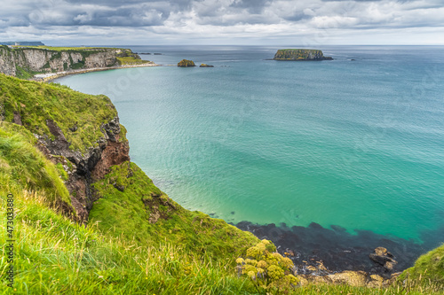 Coastline with tall limestone cliffs, Sheep Island and turquoise Atlantic Ocean, near Carrick a Rede rope bridge, Wild Atlantic Way, Northern Ireland