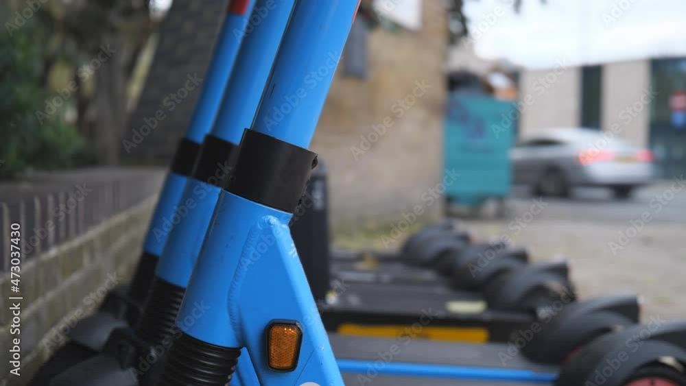 A close up view of electric scooters in a parking. A close up view of electric scooters in a parking.