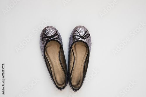 Elegant holiday shoes. View from above. Shiny shoes for a special day. Christmas shoes for the holiday. Iridescent sequins