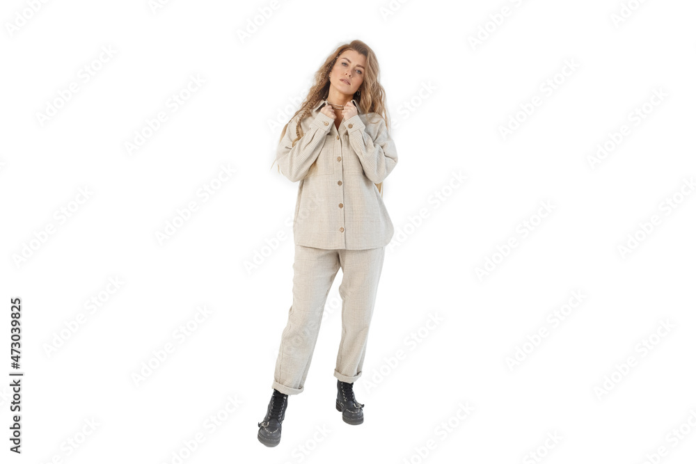 Portrait of a business woman, stands holding the edges of her jacket and looks straight. Isolated on white background. Portrait of a business woman, stands holding the edges of her jacket and looks straight. Isolated on white background.