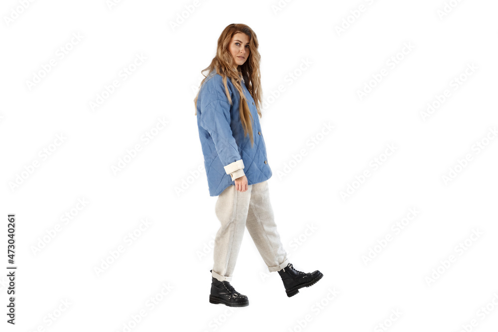 The woman looks into the camera and walks. Isolated on white background. The woman looks into the camera and walks. Isolated on white background.