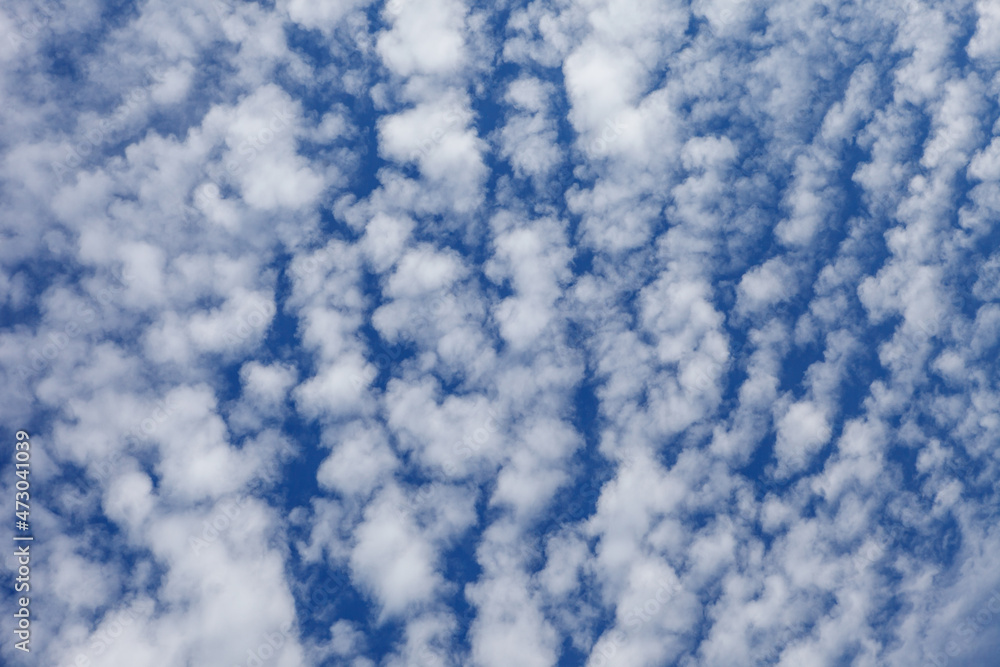 Beautiful layered cumulus clouds on a blue sky background. Stratocumulus clouds Beautiful layered cumulus clouds on a blue sky background. Stratocumulus clouds
