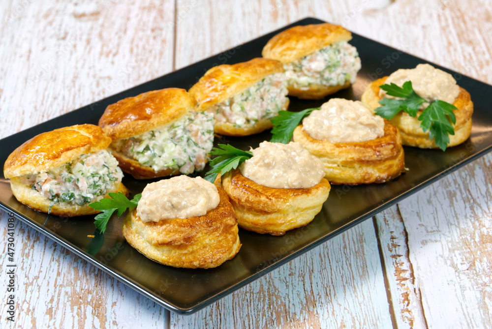 puff pastry-filled appetizer with salad filling on a plate. close up puff pastry-filled appetizer with salad filling on a plate. close up