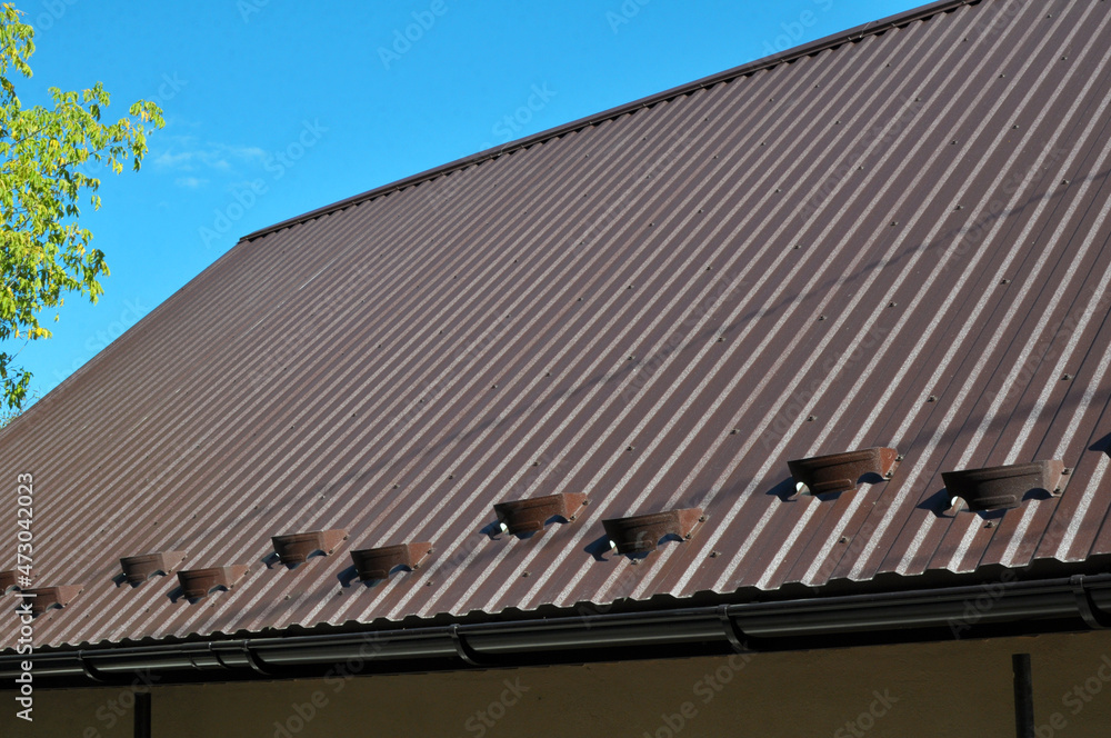 The building is covered with profiled metal sheet The building is covered with profiled metal sheet