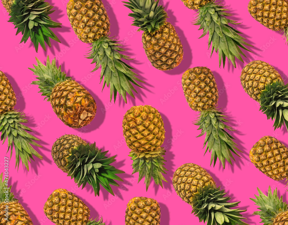 pineapple lies on a bright background. Fresh juicy tropical yellow fruit pineapple lies on a bright background. Fresh juicy tropical yellow fruit
