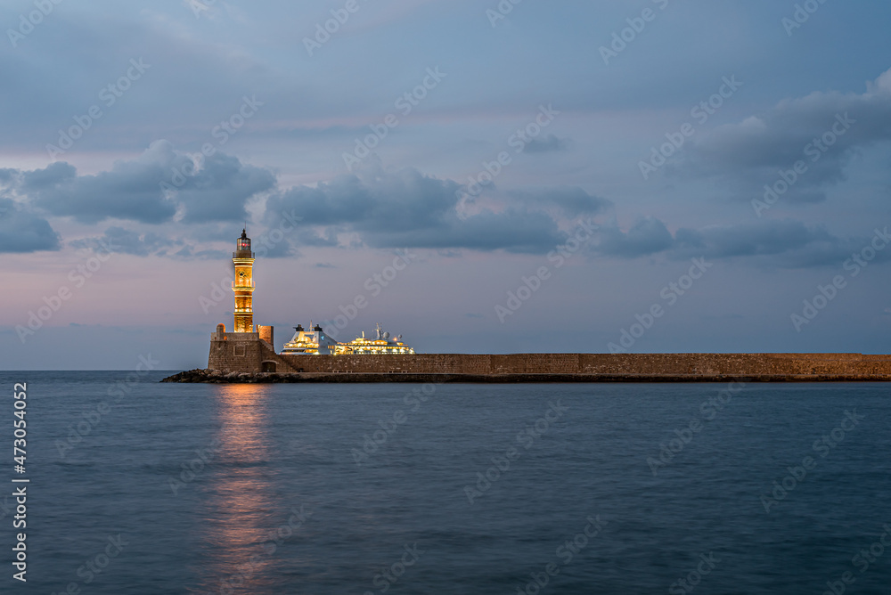 the lighthouse and a cruise ship in the old harbour of Chania