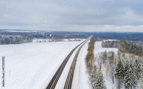 Aerial bird-eye view on freeway road in the winter field © yauhenka
