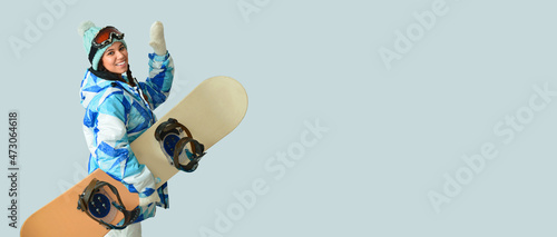 Female snowboarder on light...