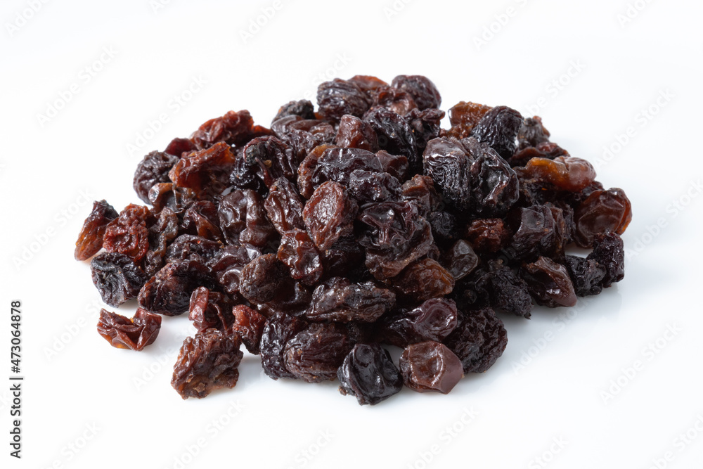 Serving of sweet and healthy dehydrated dark raisins Serving of sweet and healthy dehydrated dark raisins