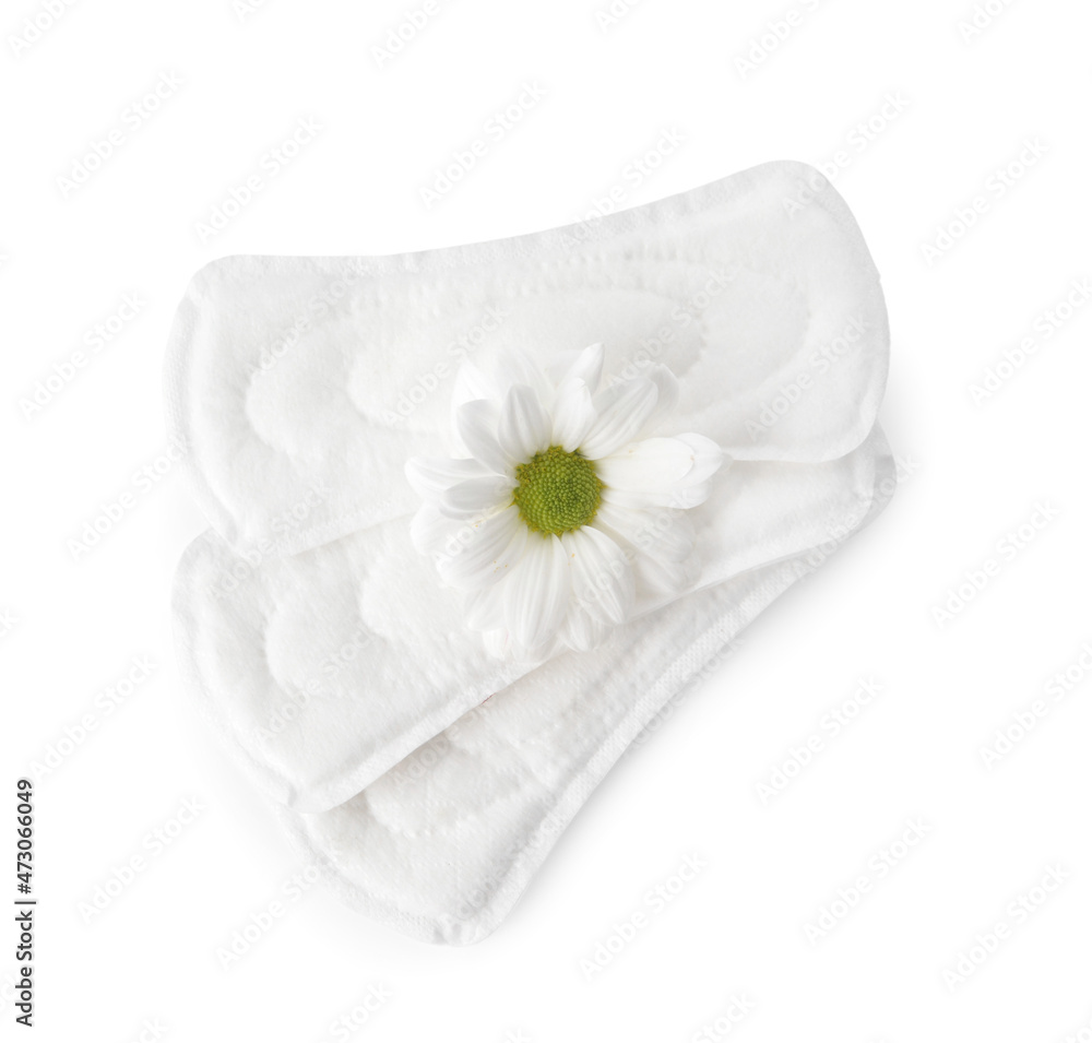 Menstrual pads and chamomile flower on white background Menstrual pads and chamomile flower on white background