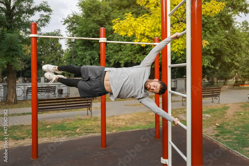 Young man training on sport ground