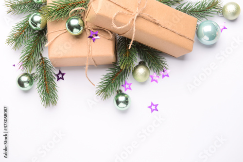 Christmas decor, fir branches and gift boxes on white background