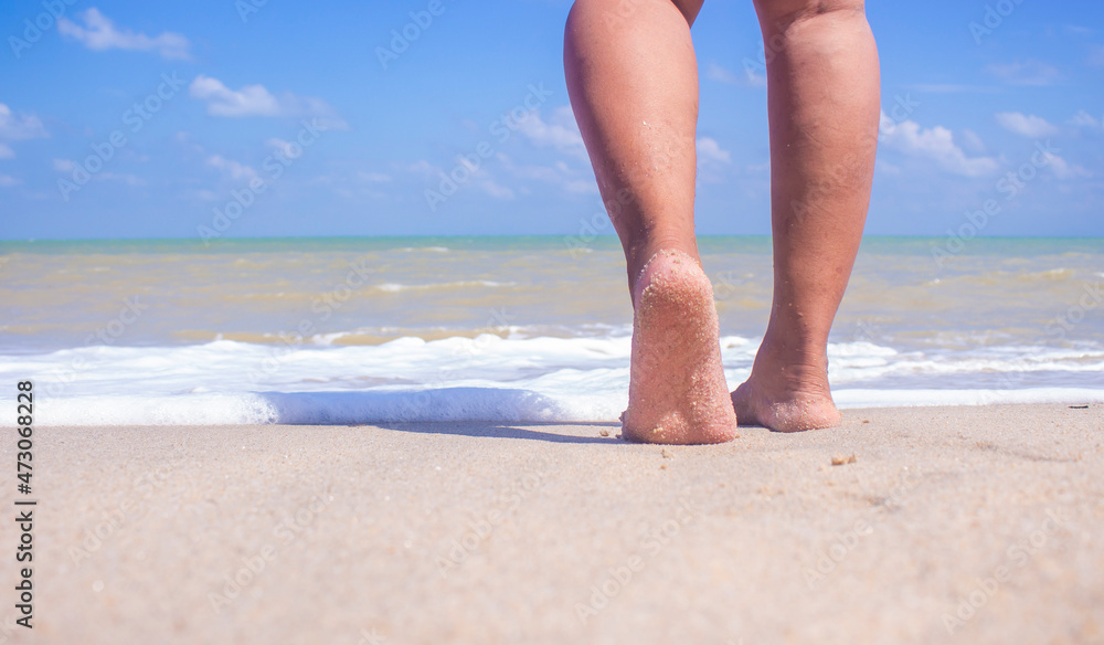 Woman feet walking on beach barefoot closeup. Honeymoon travel vacation, Woman feet walking on beach barefoot closeup. Honeymoon travel vacation,