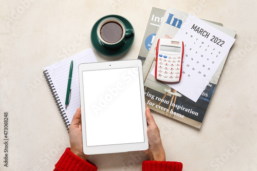 Female hands with tablet co...
