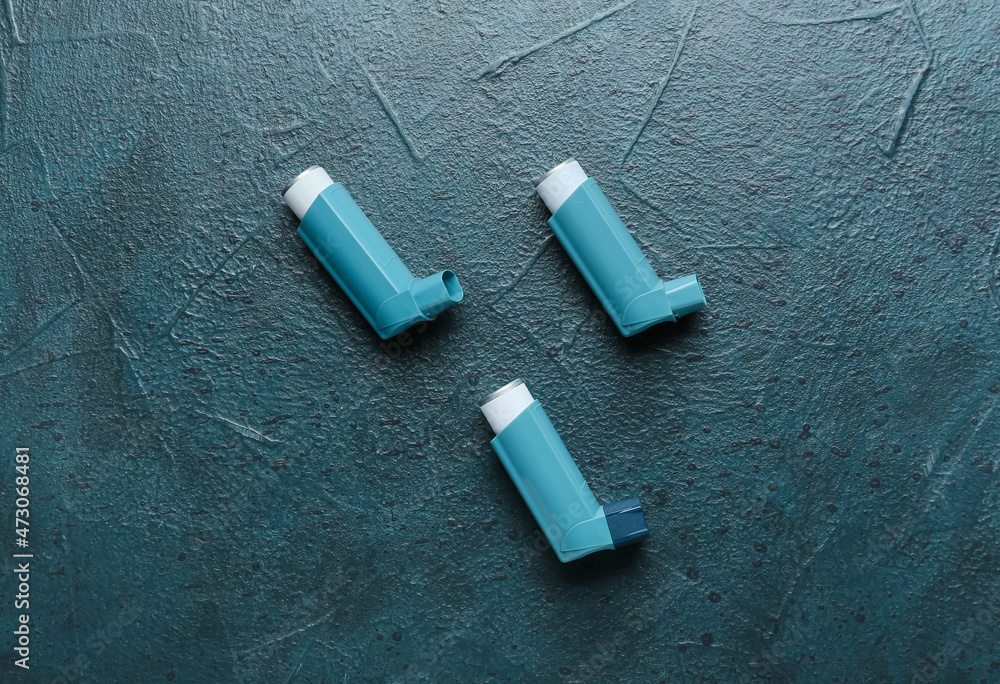 Asthma inhalers on dark background Asthma inhalers on dark background