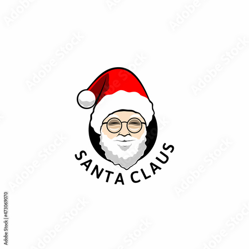 Santa Claus logo. Sinterklas head with red hat photo