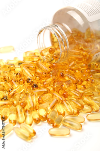 Vitamin Omega-3 fish oil capsules on white background