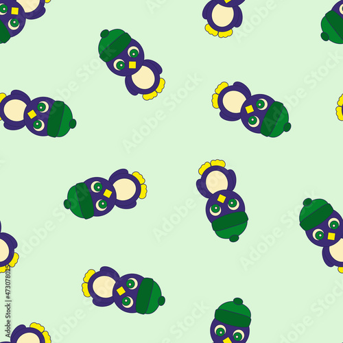 Seamless Pattern with Penguin on Green Background.