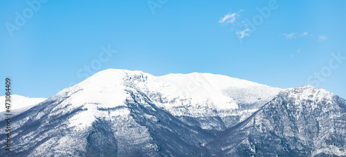 Stunning view of a snowcapped mountain range during a sunny day.