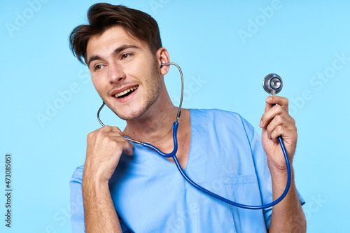 man in medical uniform stethoscope examination work blue background