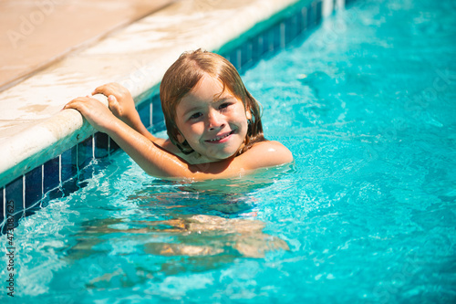 Summer activities for happy child on the pool. Child relax in summer swimming pool.