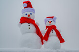 Snow man. Two snowman on snow background.
