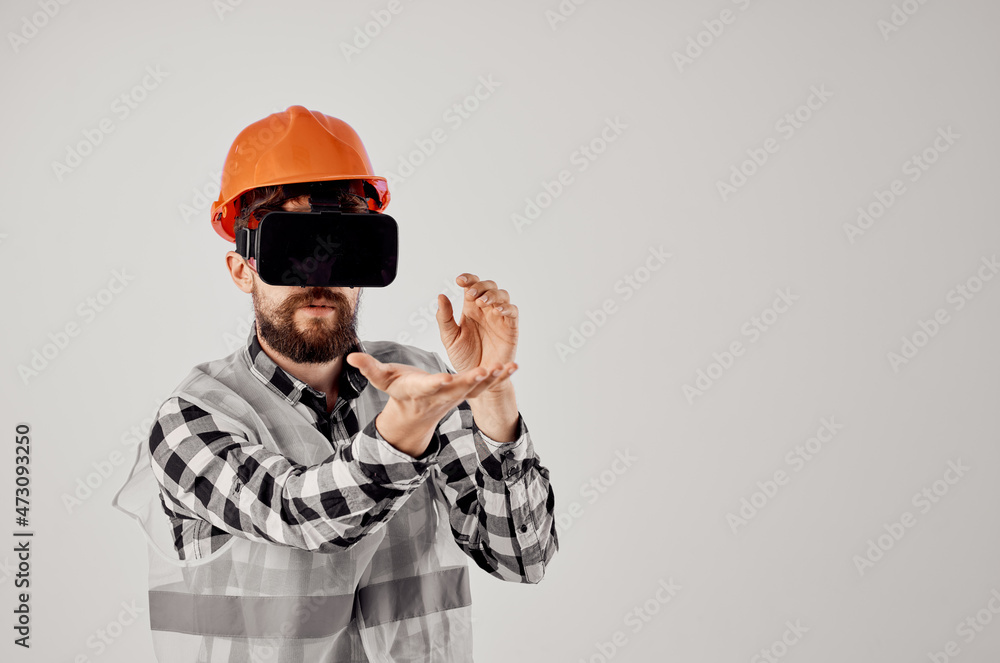 engineer in an orange helmet technology Professional isolated background engineer in an orange helmet technology Professional isolated background
