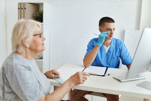 elderly woman at the doctor s appointment health care