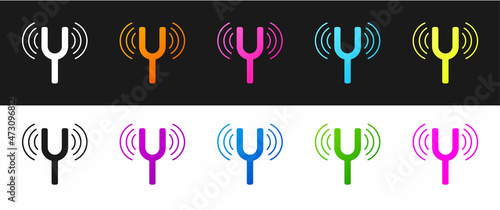 Set Musical tuning fork for tuning musical instruments icon isolated on black and white background. Vector