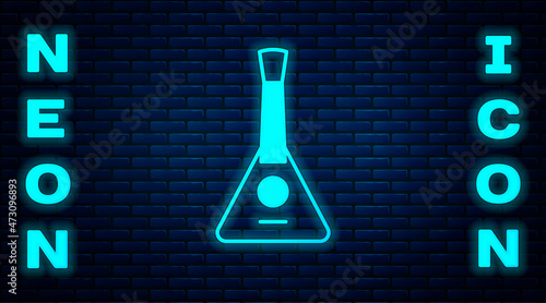 Glowing neon Musical instrument balalaika icon isolated on brick wall background. Vector