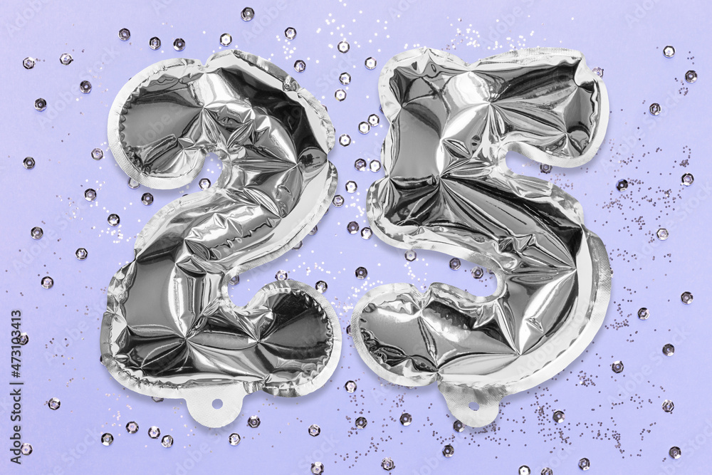 Silver foil balloon number, digit twenty five on a lilac background with sequins. Birthday greeting card with inscription 25. Anniversary concept. Numerical digit. Celebration event, template. Silver foil balloon number, digit twenty five on a lilac background with sequins. Birthday greeting card with inscription 25. Anniversary concept. Numerical digit. Celebration event, template.