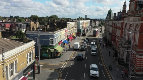 street lined with town houses. Life in urban neighbourhood. Sunny day in Leyton. London, UK photo