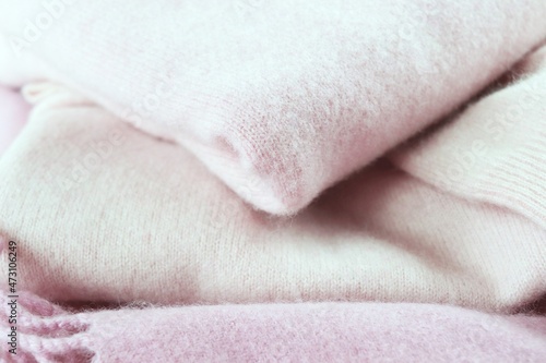 Stack of pink cashmere, virgin wool, warmth and winter comfort concept
