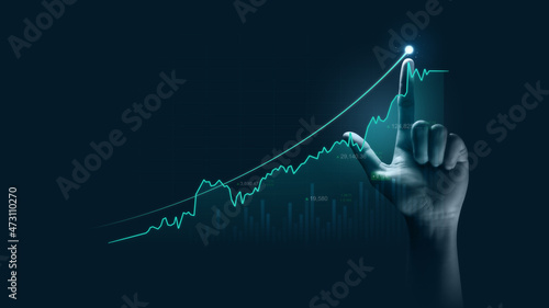 Photographie Businessman hand pointing finger to growth success finance business chart of metaverse technology financial graph investment diagram on analysis stock market background with digital economy exchange