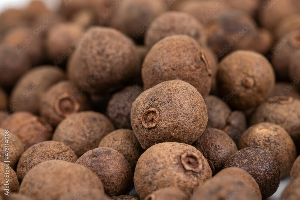Pile of dried allspice fruits spices macro shot Pile of dried allspice fruits spices macro shot