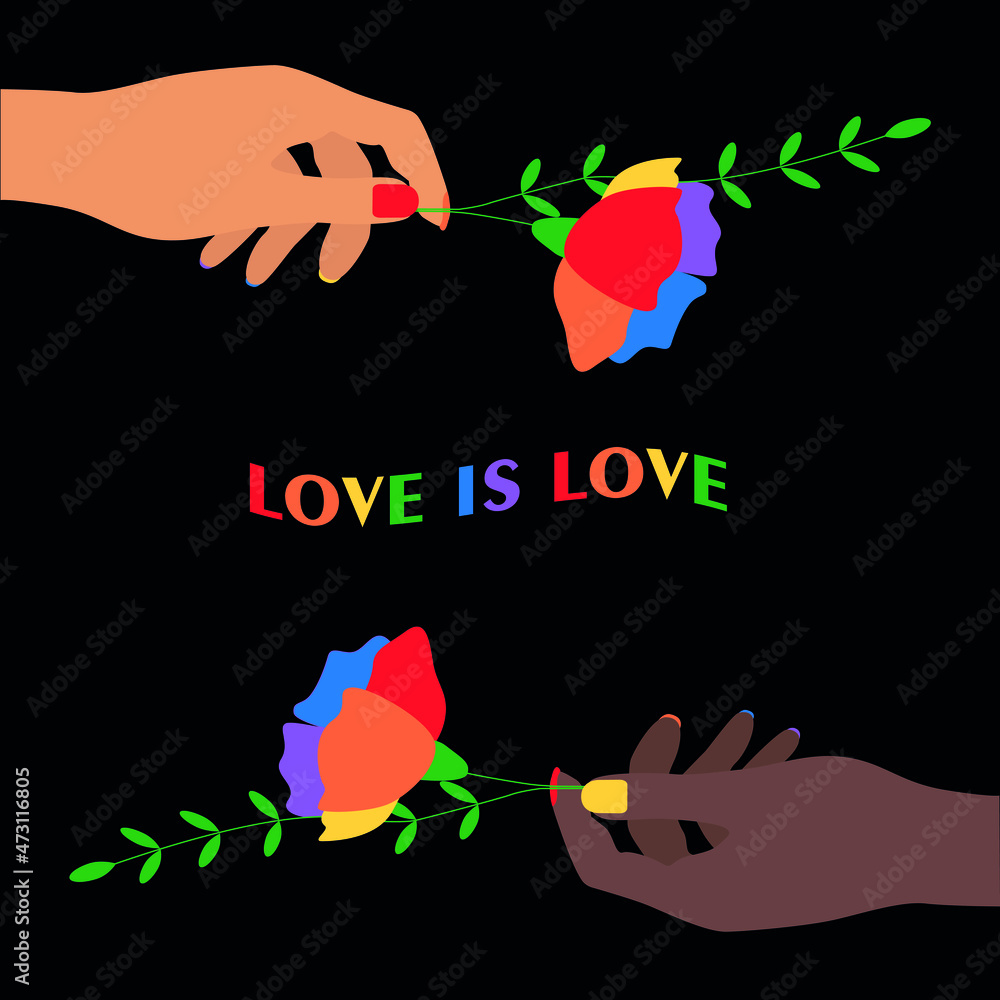 The hands of young girls hold flowers with the flag of the LGBT